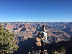 Tucson Board-Certified female Plastic Surgeon, Dr. Jamie Moenster standing in front of the Grand Canyon during her rim-to-rim hike. 